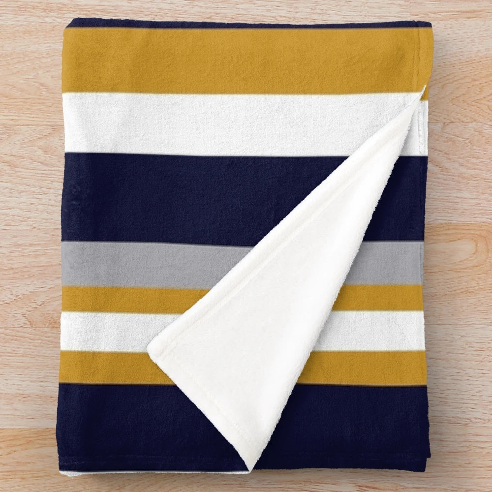 Vertical stripe plush blanket in mustard, navy, and gray colors