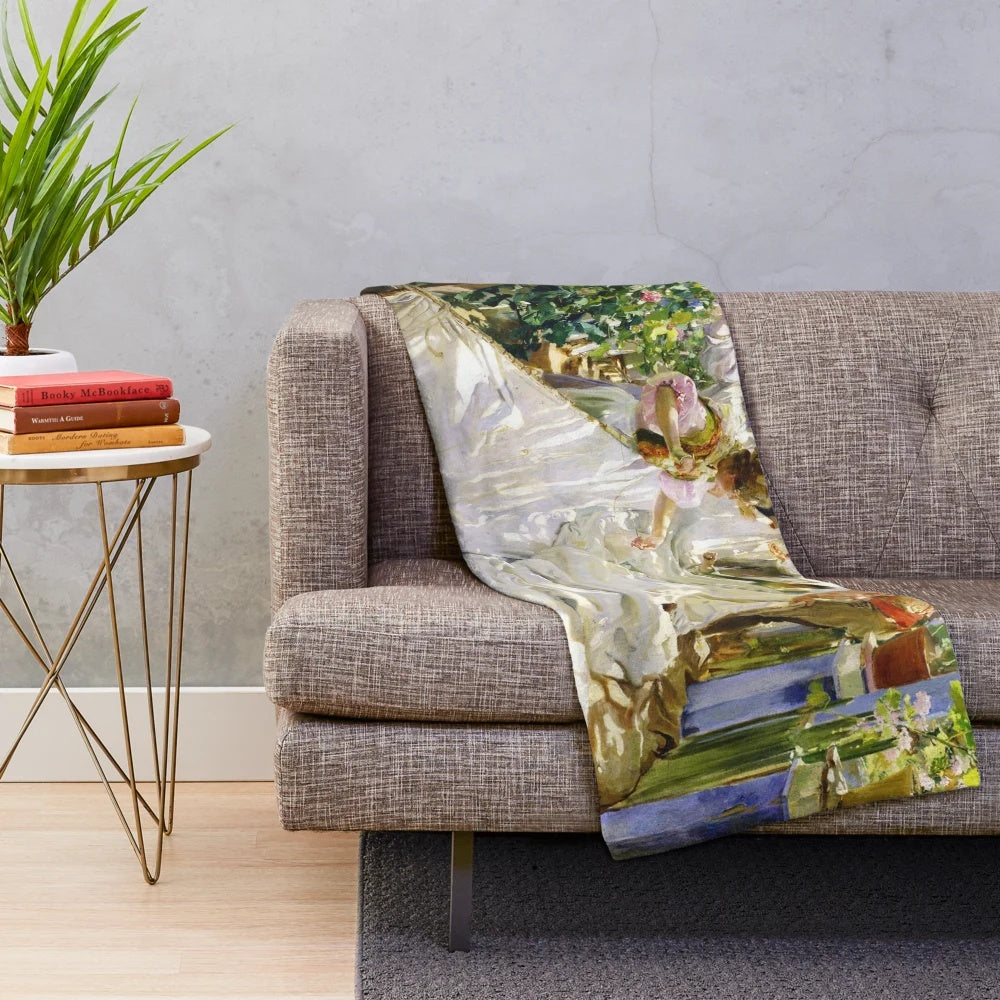 Sorolla's 'Sewing the Sail' 1896 painting on a plush blanket
