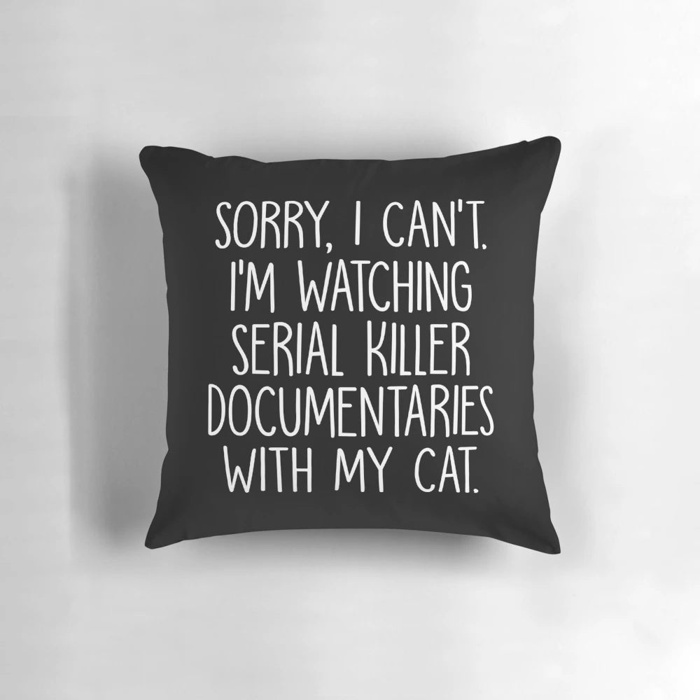 A funny pillow with the text "Sorry I Can't I'm Watching True Crime Documentaries With My Cat