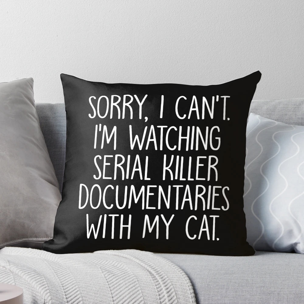 A funny pillow with the text "Sorry I Can't I'm Watching True Crime Documentaries With My Cat