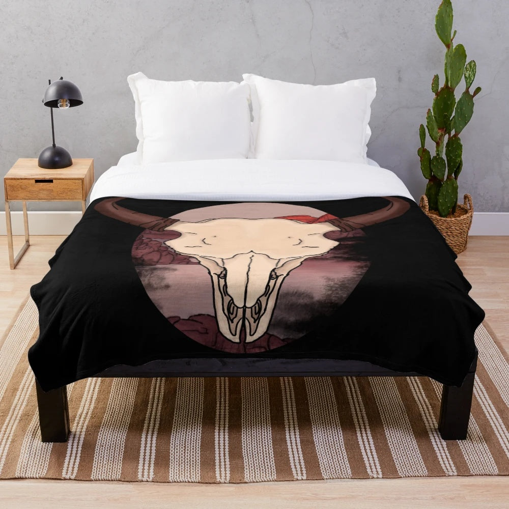 Cozy plush blanket featuring a bison skull design in earthy southwestern tones