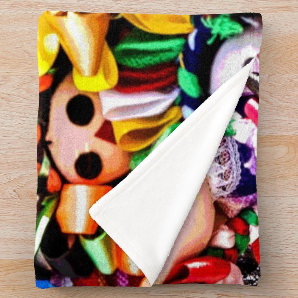 Southwestern-style plush blanket featuring colorful folklorico-inspired dolls