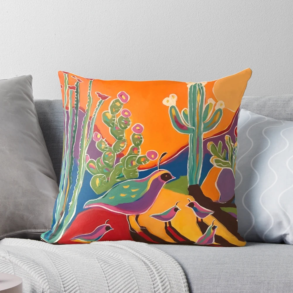 Vibrant throw pillow featuring a sunset landscape with ocotillo, saguaro, and quail silhouettes