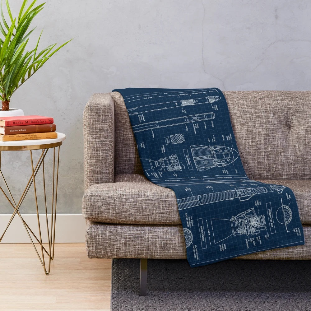 Plush blanket featuring a navy blueprint-style design of the SpaceX Falcon 9 rocket and Starship spacecraft