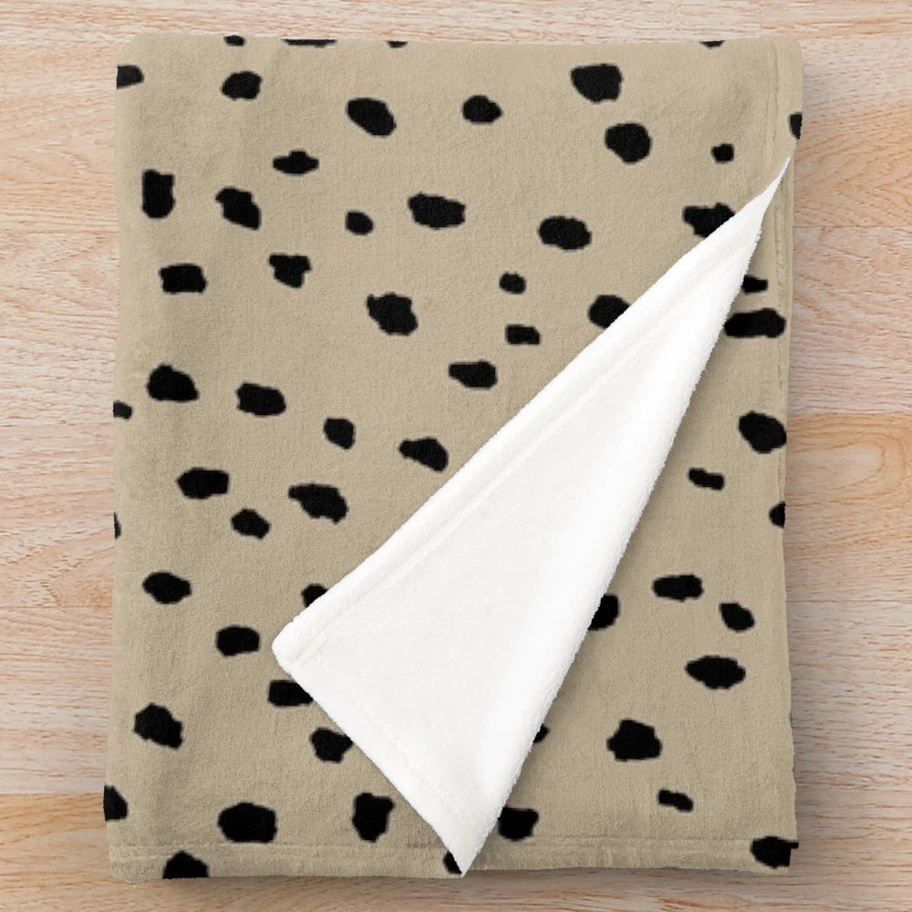 Speckled polka dot dalmatian pattern plush blanket in neutral colors