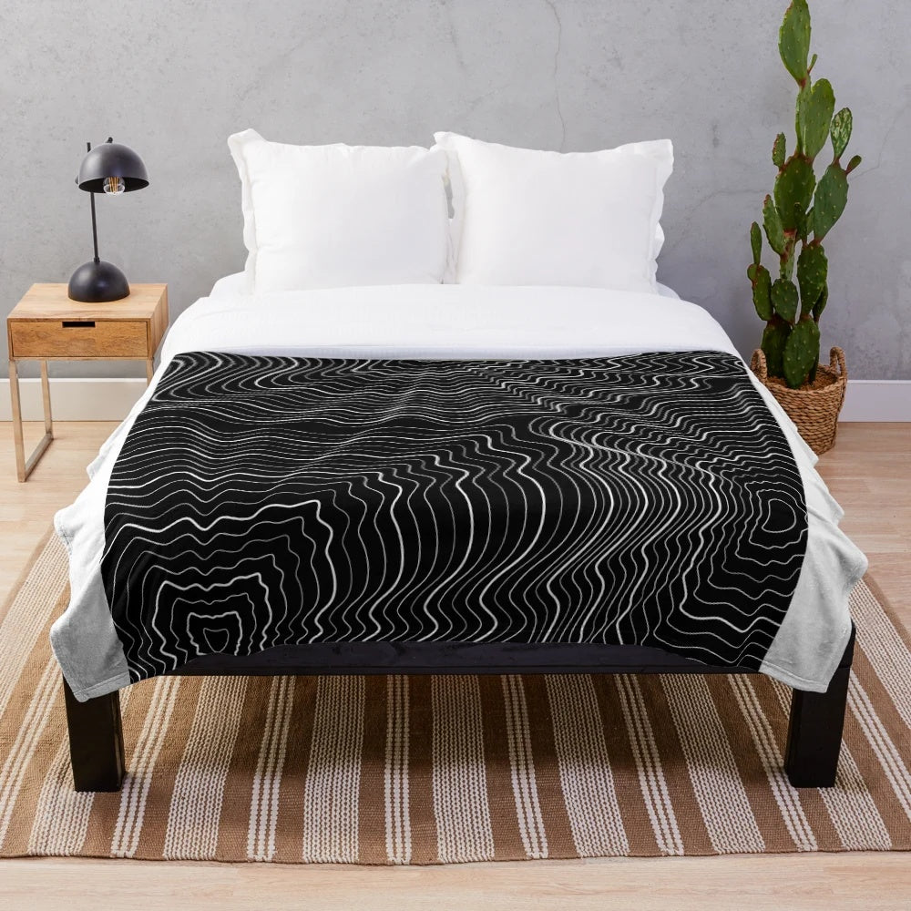 Spiderweb patterned plush blanket for cozy, relaxing decor