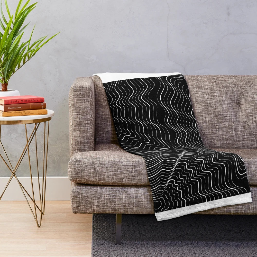 Spiderweb patterned plush blanket for cozy, relaxing decor