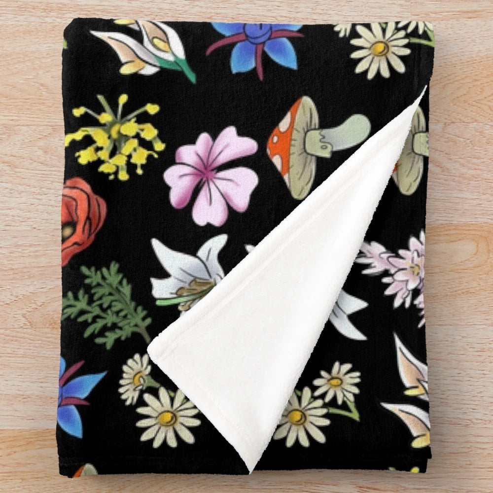 Soft and cozy plush blanket featuring a watercolor-style floral design inspired by the indie game SpiritFarer