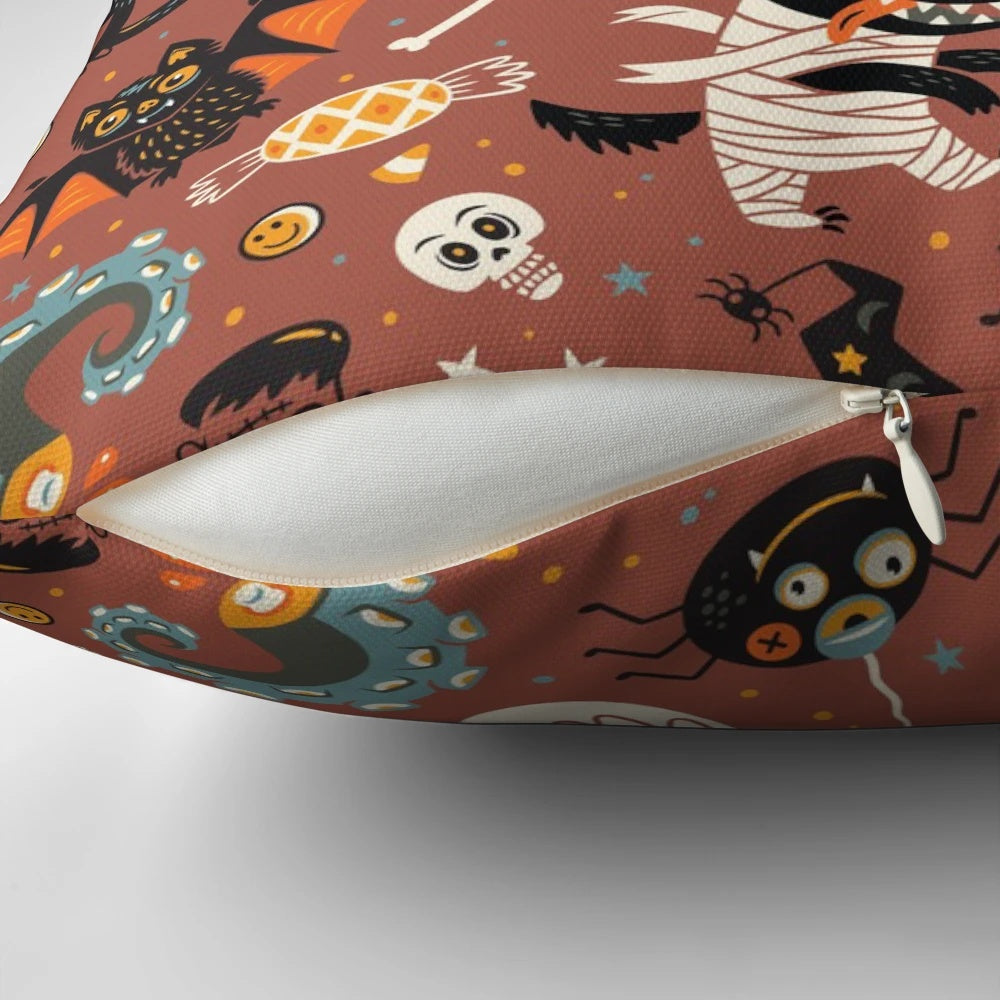 A cozy and decorative Halloween-themed pillow with a seamless pattern featuring pumpkins, monsters, and other holiday graphics.