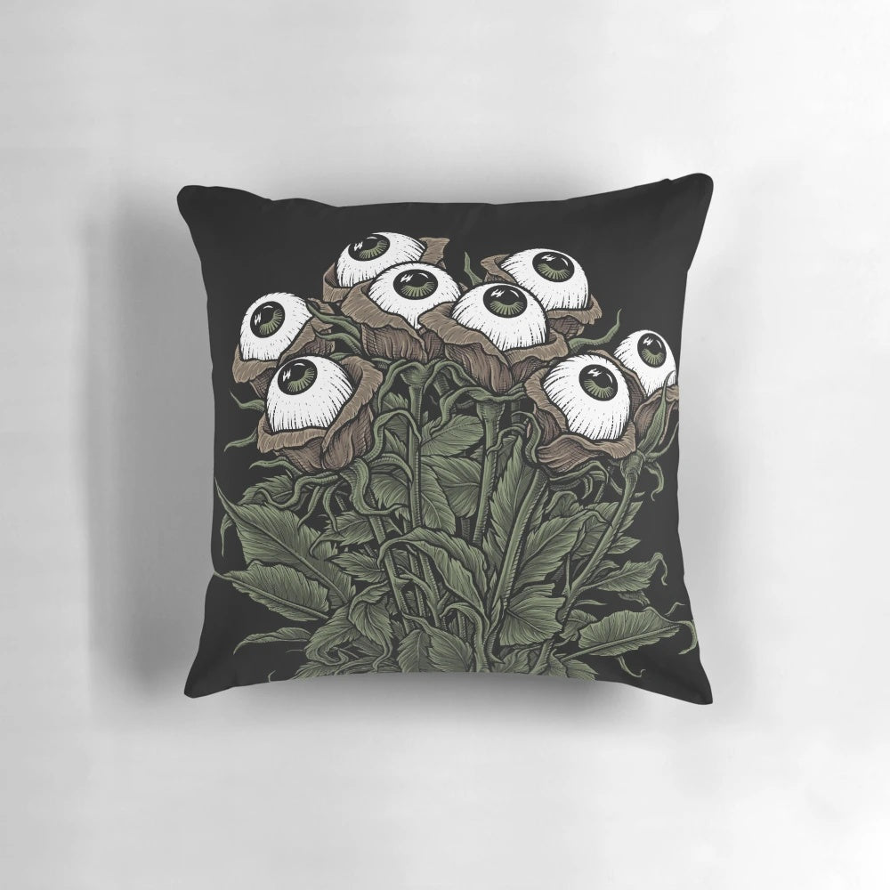 A soft, plush monster-themed bouquet pillow with a spooky yet cute design.