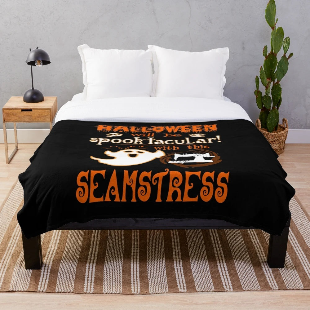 Handmade plush blanket featuring spooky sewing-themed Halloween design