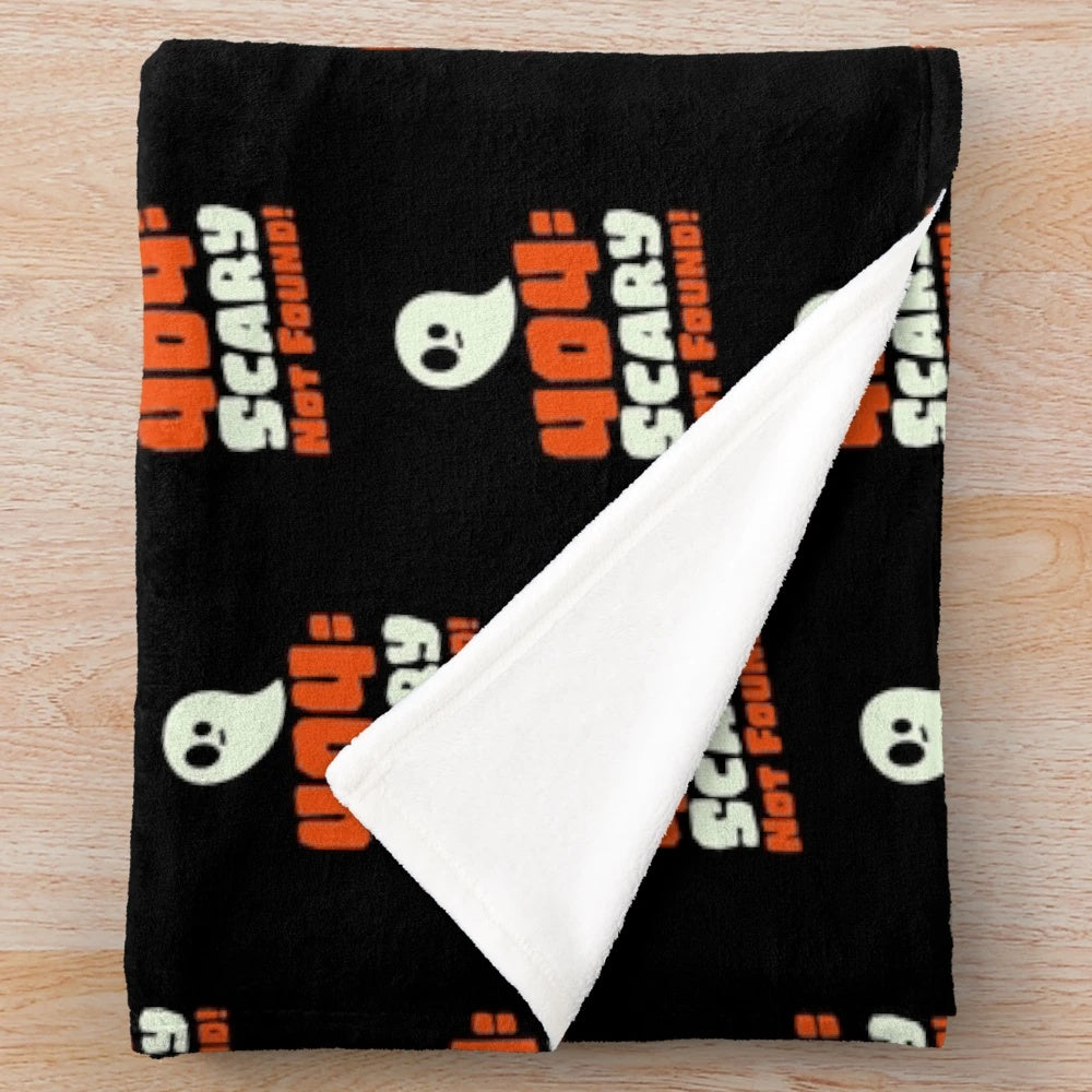 Halloween-themed plush blanket with a 404 error message design