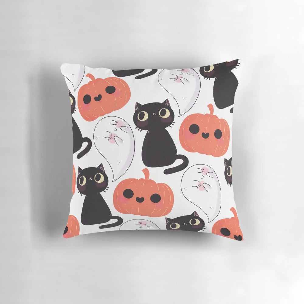 A cozy, spooky-themed pillow with a cute cat and pumpkin pattern
