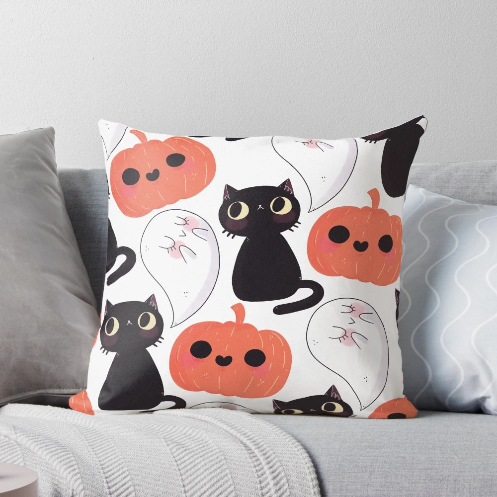A cozy, spooky-themed pillow with a cute cat and pumpkin pattern
