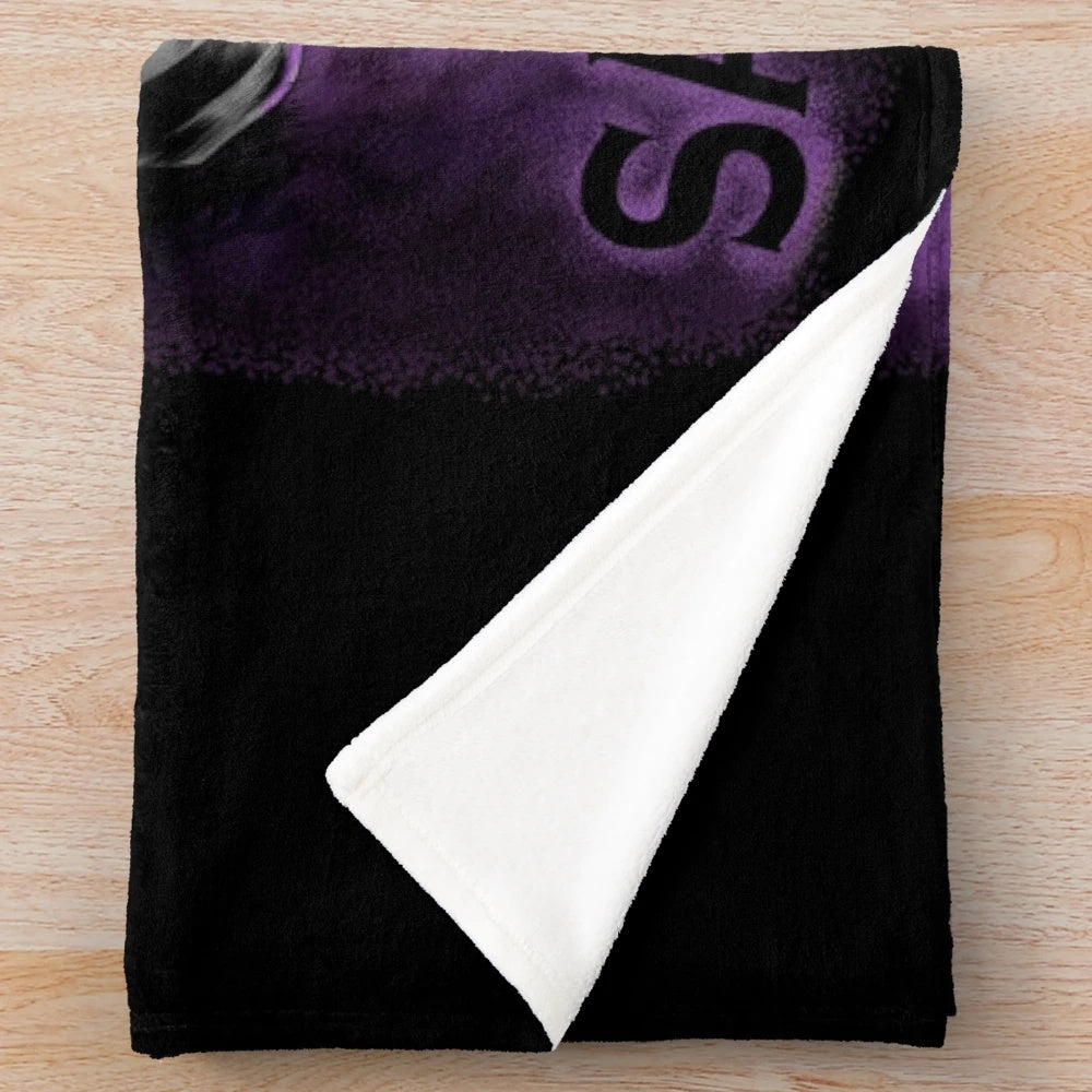 Beetlejuice-themed plush blanket with spooky, gothic design
