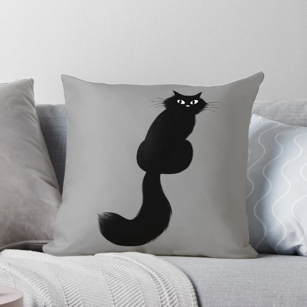 Plush black cat pillow with long hair and side-eye expression, perfect for Halloween and home decor.