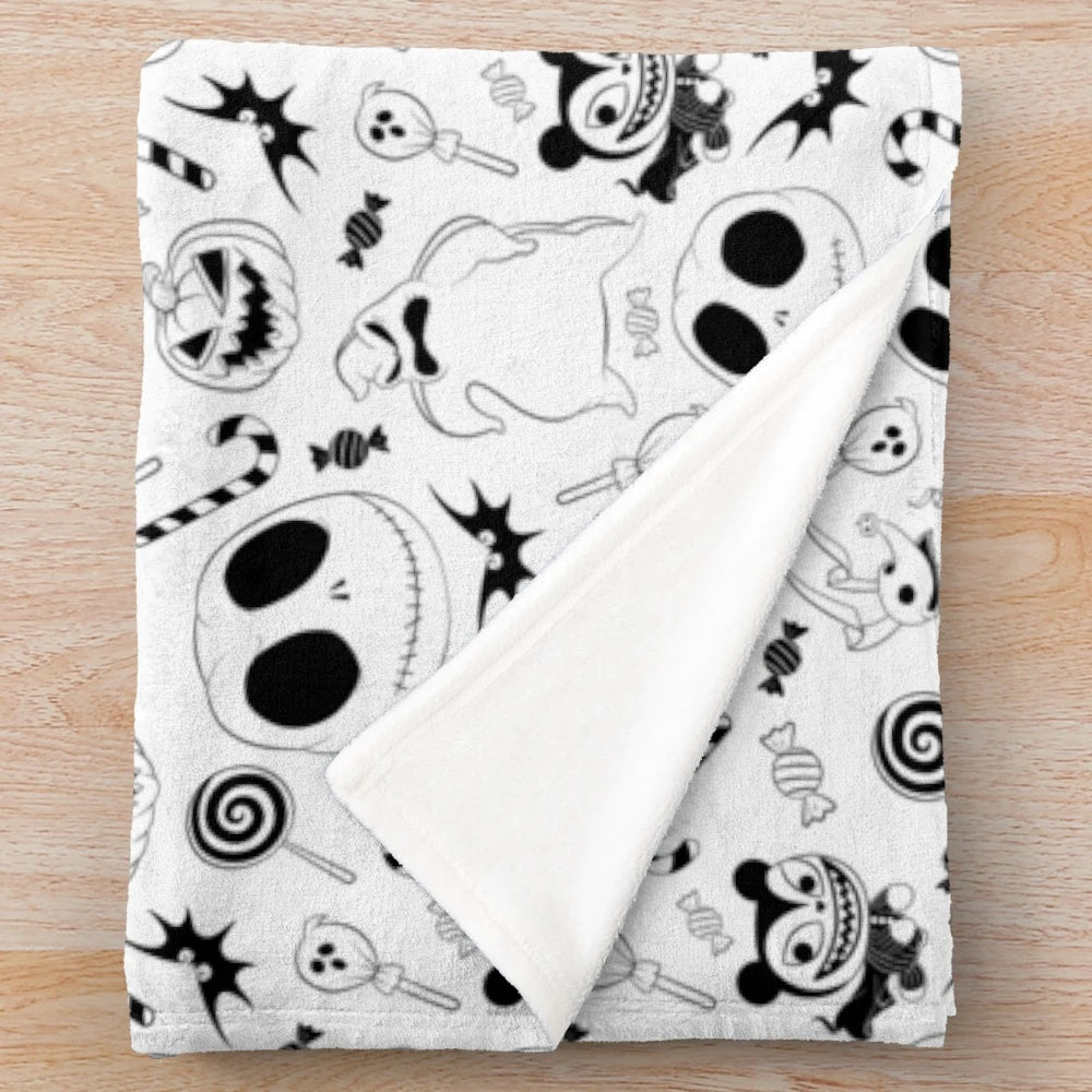 Plush black and white patterned blanket with spooky, gothic, and Halloween-inspired design