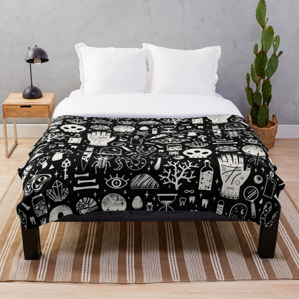 Bone black plush blanket with spooky, occult-inspired design
