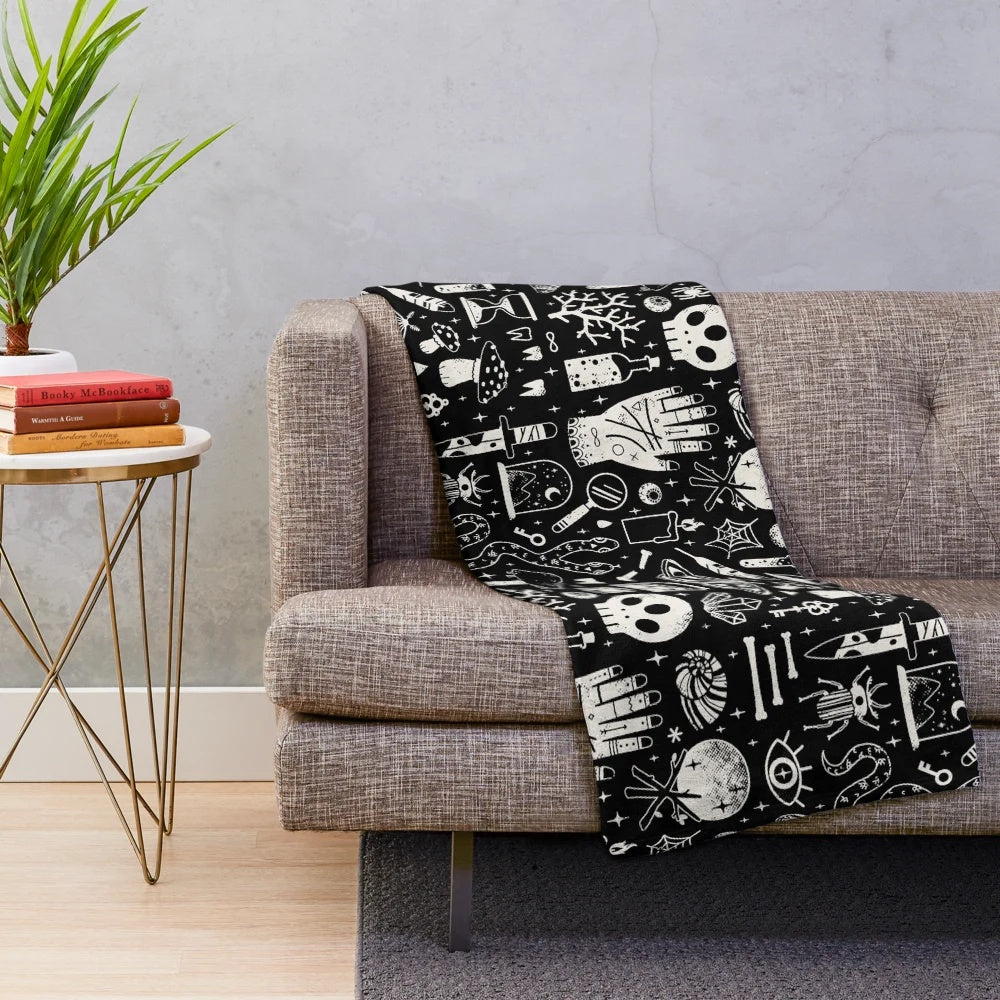 Bone black plush blanket with spooky, occult-inspired design