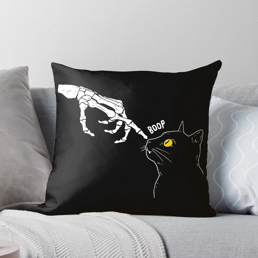 A spooky yet cute cat skeleton pillow with a "boop" graphic, perfect for Halloween and pet lovers.