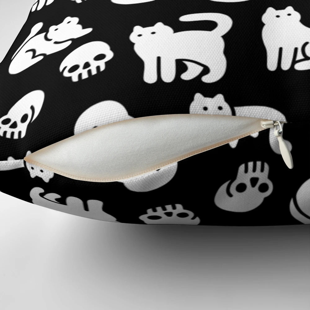 Decorative pillow featuring a pattern of cute cats and skulls, perfect for Halloween and spooky home decor