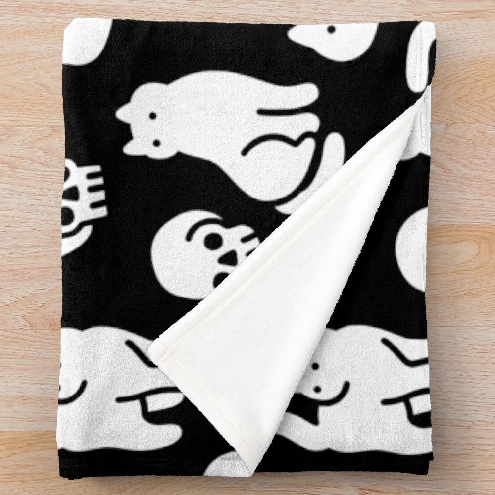 Plush blanket with cats and skulls pattern