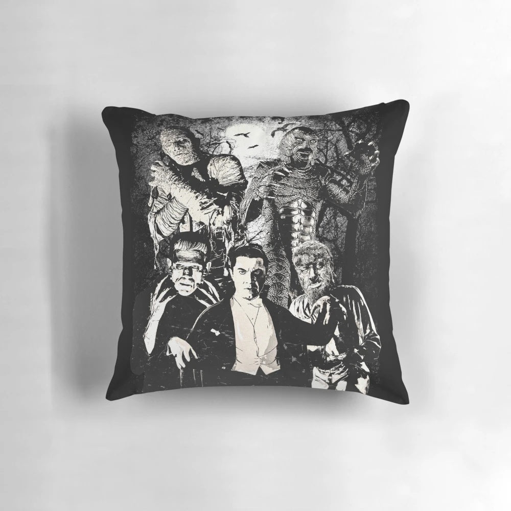Decorative pillow featuring classic horror movie monsters like Dracula, Wolfman, and Frankenstein