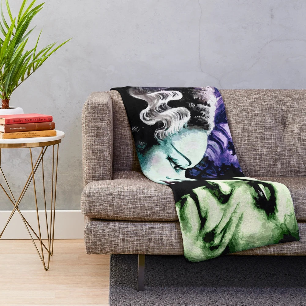 Plush blanket featuring the Bride of Frankenstein and Frankenstein's monster
