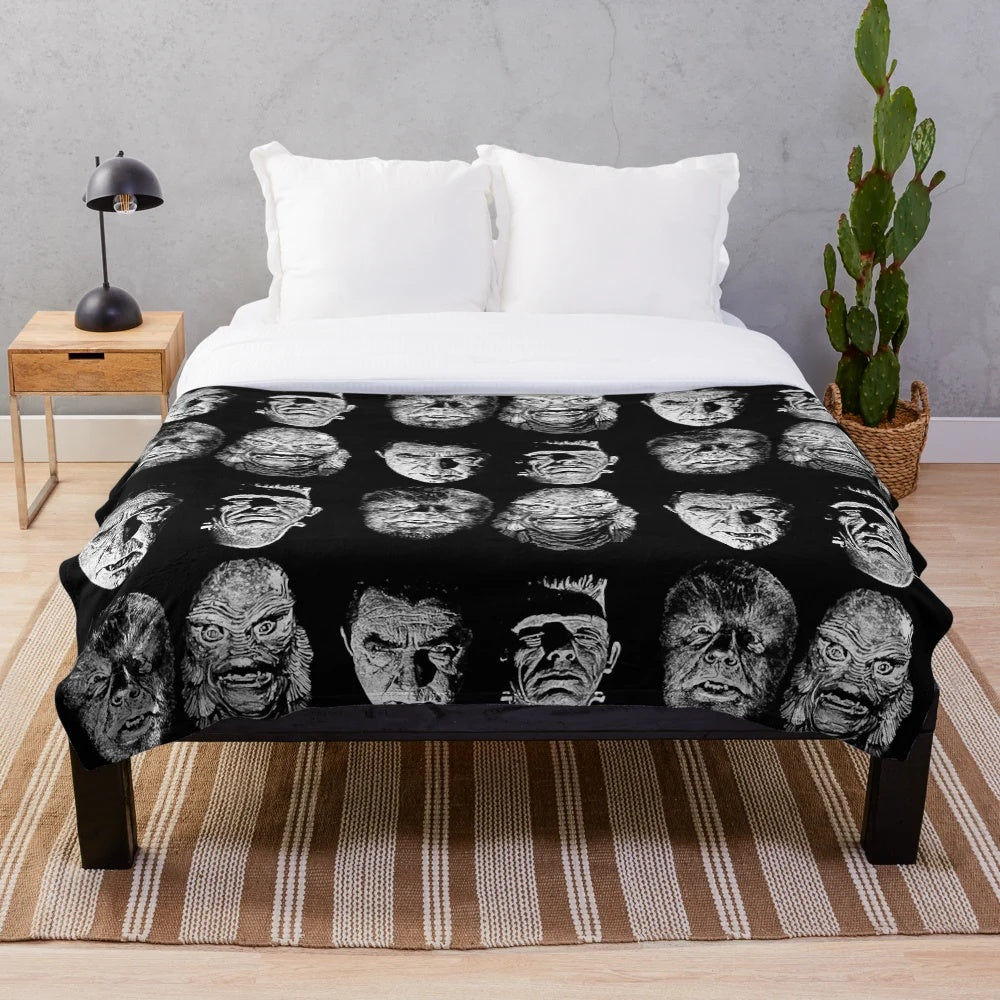 Classic horror-themed plush blanket featuring iconic monsters and characters