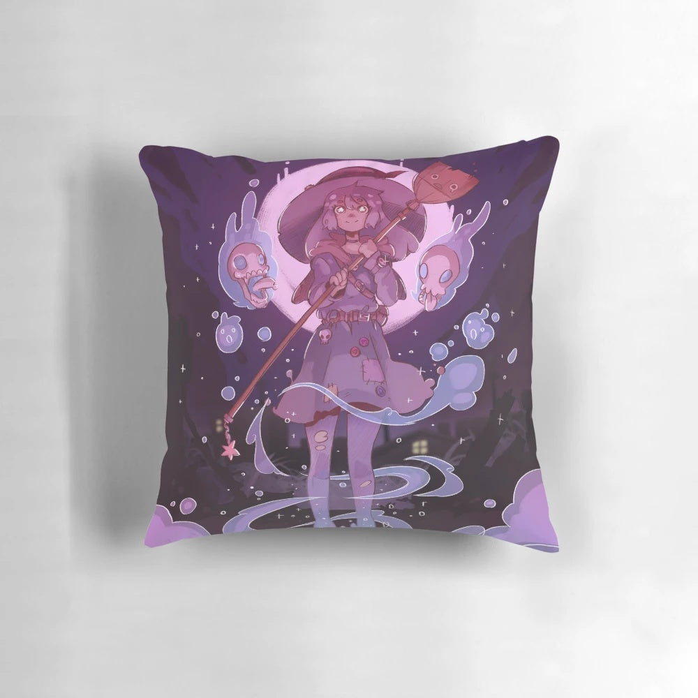 A decorative pink and black witch-themed pillow with a cute skull design, perfect for Halloween home décor.