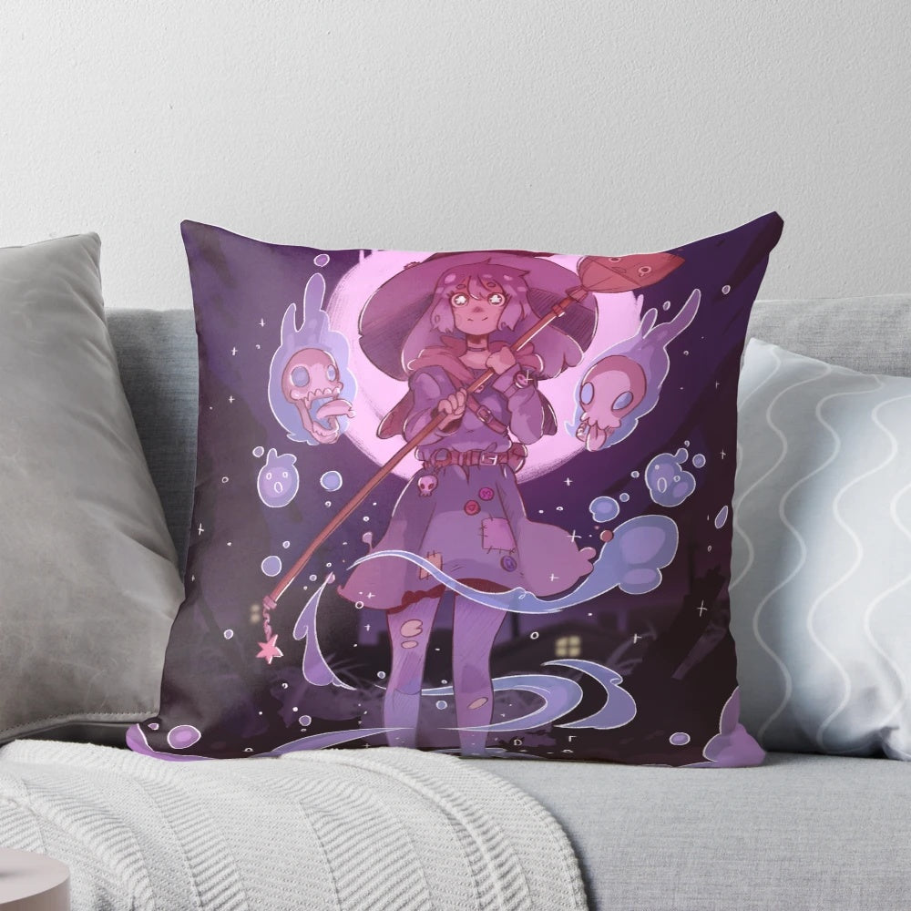 A decorative pink and black witch-themed pillow with a cute skull design, perfect for Halloween home décor.