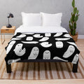 Soft and cuddly black and white ghost plush blanket