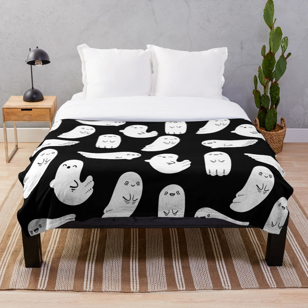 Soft and cuddly black and white ghost plush blanket