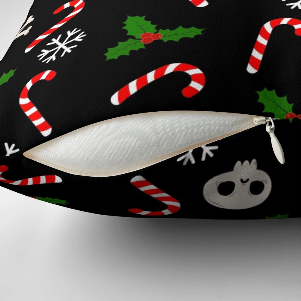 A gothic-style Christmas pillow featuring skulls, holly, and a moody black and red pattern.