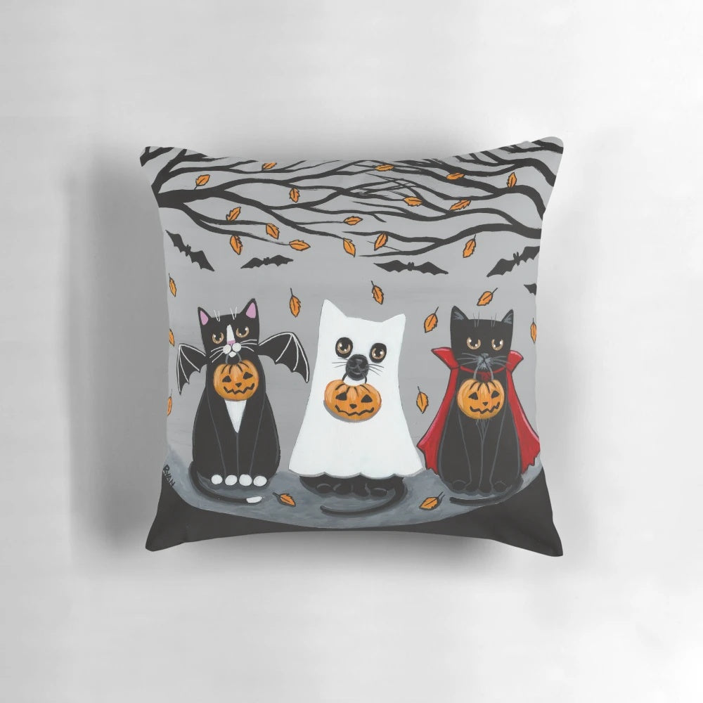 A festive Pillow featuring a whimsical black, tuxedo, ghost, and bat cat design - perfect for Halloween and cat lovers.