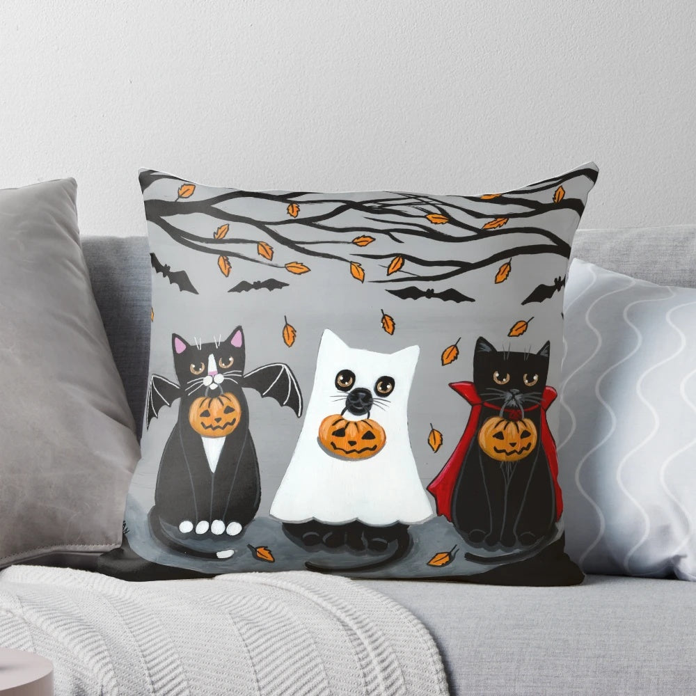 A festive Pillow featuring a whimsical black, tuxedo, ghost, and bat cat design - perfect for Halloween and cat lovers.