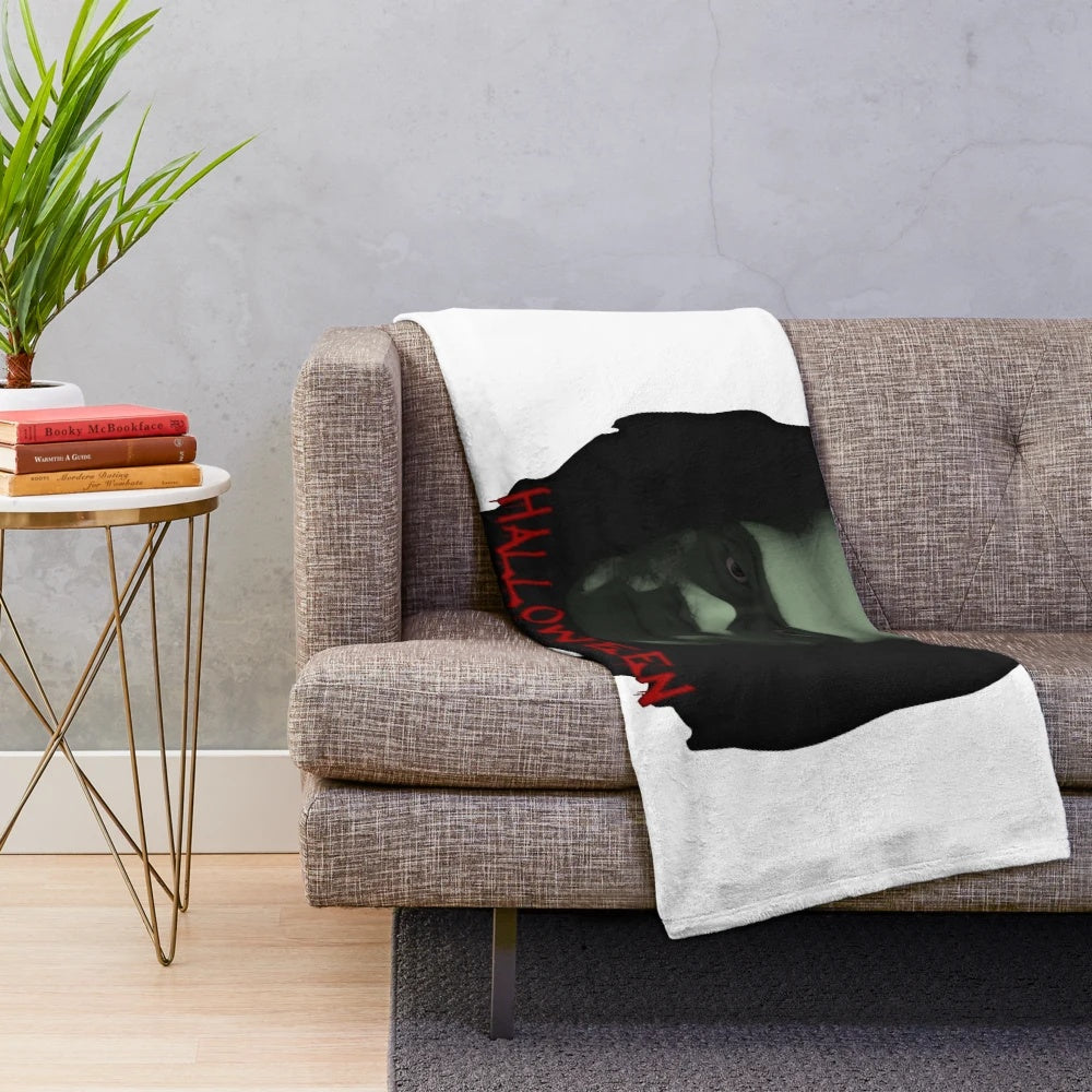 Halloween-themed plush blanket with spooky designs