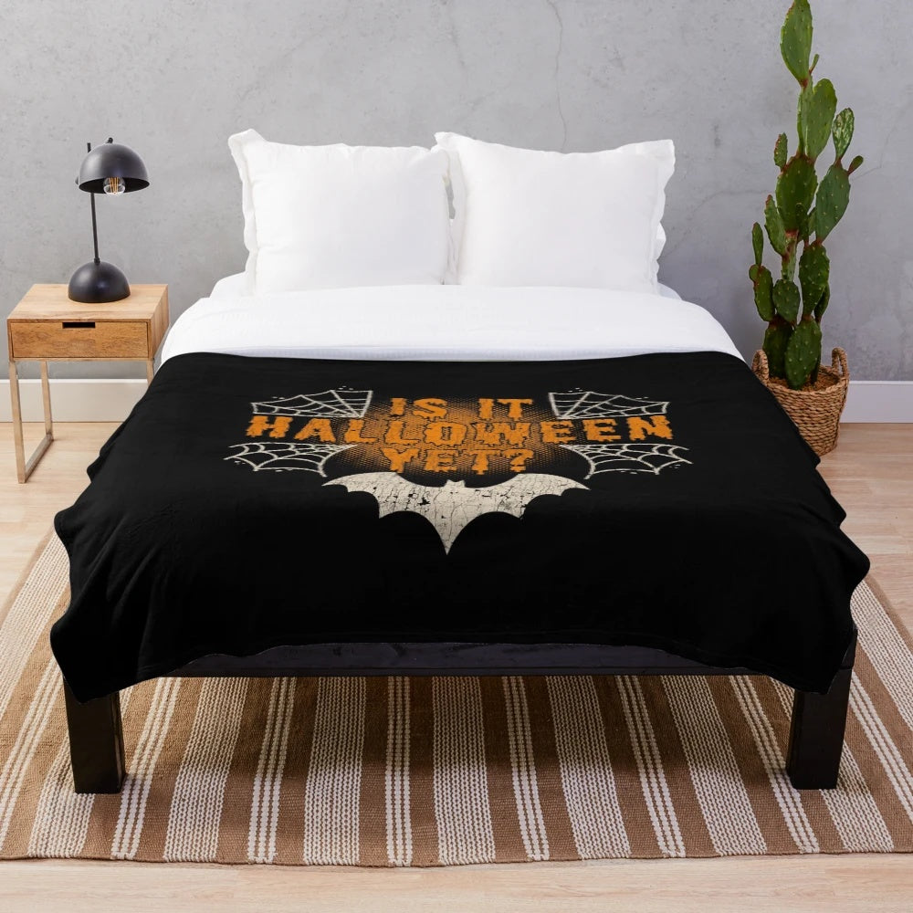 Distressed Halloween plush blanket with spider web and cobweb design