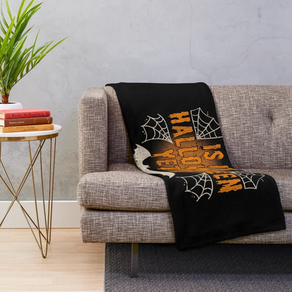 Distressed Halloween plush blanket with spider web and cobweb design