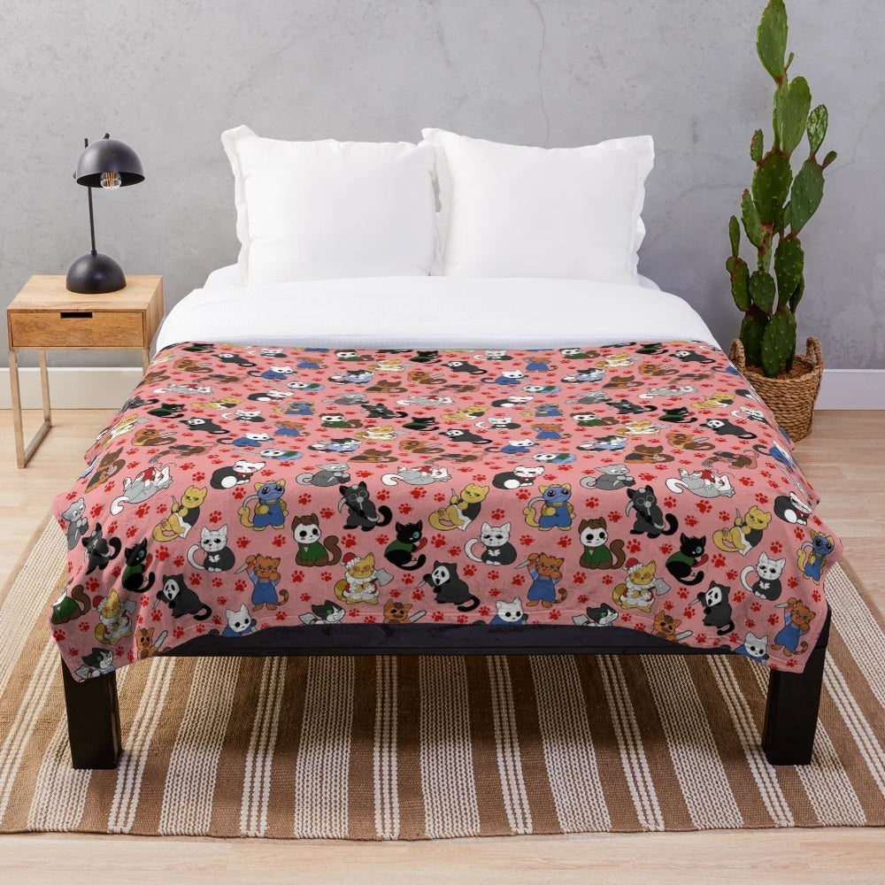 Plush blanket featuring a pattern of horror-themed cats
