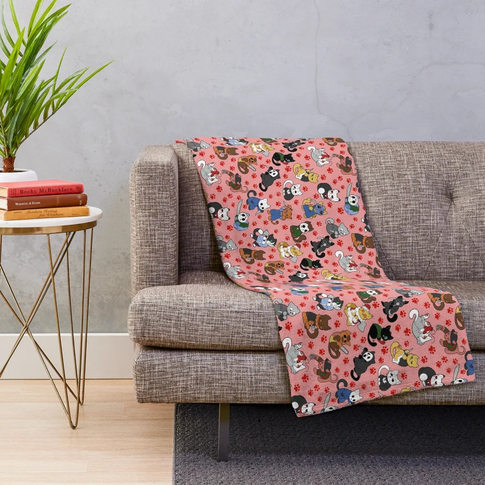 Plush blanket featuring a pattern of horror-themed cats