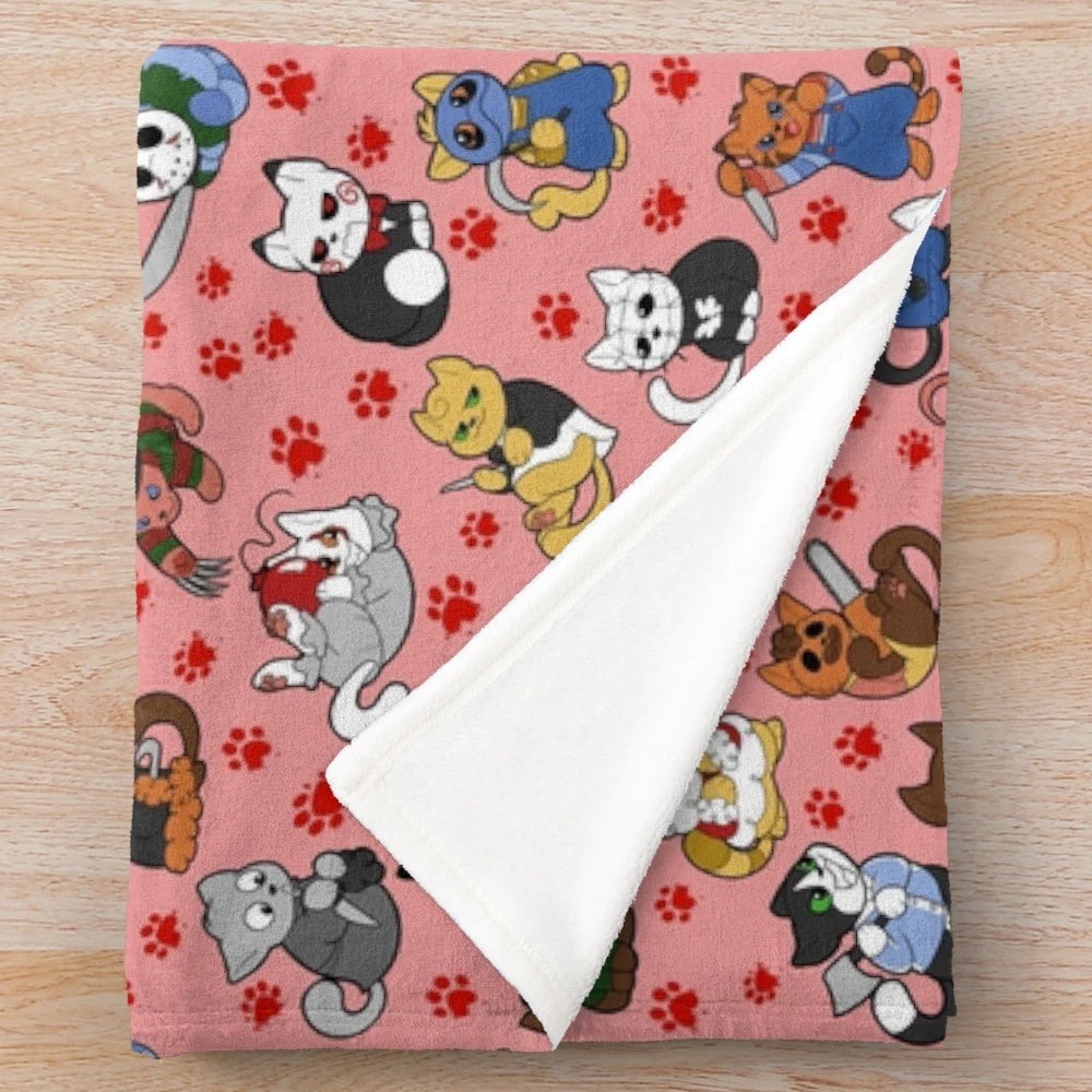 Plush blanket featuring a pattern of horror-themed cats