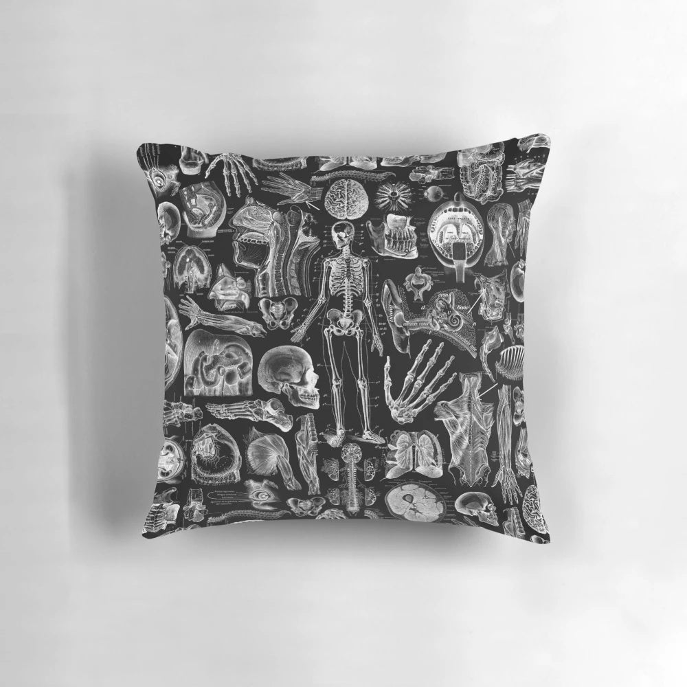 Black and white graphic print of human anatomy skeleton on a square pillow