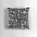 Black and white graphic print of human anatomy skeleton on a square pillow