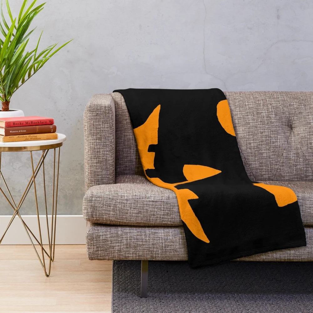 Cozy plush blanket featuring a Jack-O'-Lantern design for Halloween and horror movie enthusiasts