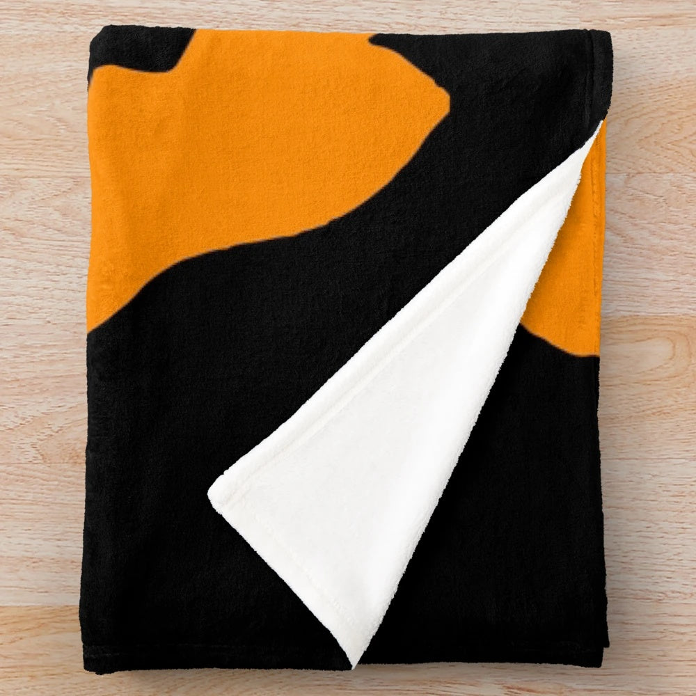 Cozy plush blanket featuring a Jack-O'-Lantern design for Halloween and horror movie enthusiasts