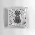 Kitten fang pillow with alchemy symbols and floral design in black, white, and grey