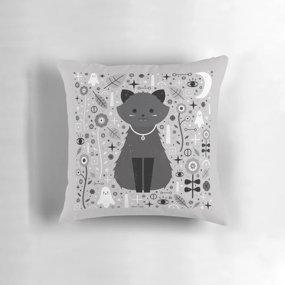 Kitten fang pillow with alchemy symbols and floral design in black, white, and grey