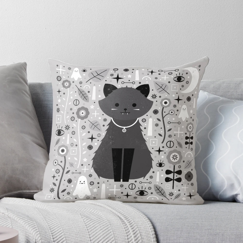 Kitten fang pillow with alchemy symbols and floral design in black, white, and grey