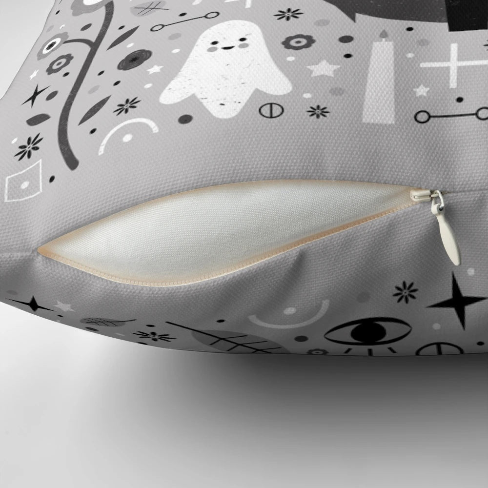 Kitten fang pillow with alchemy symbols and floral design in black, white, and grey